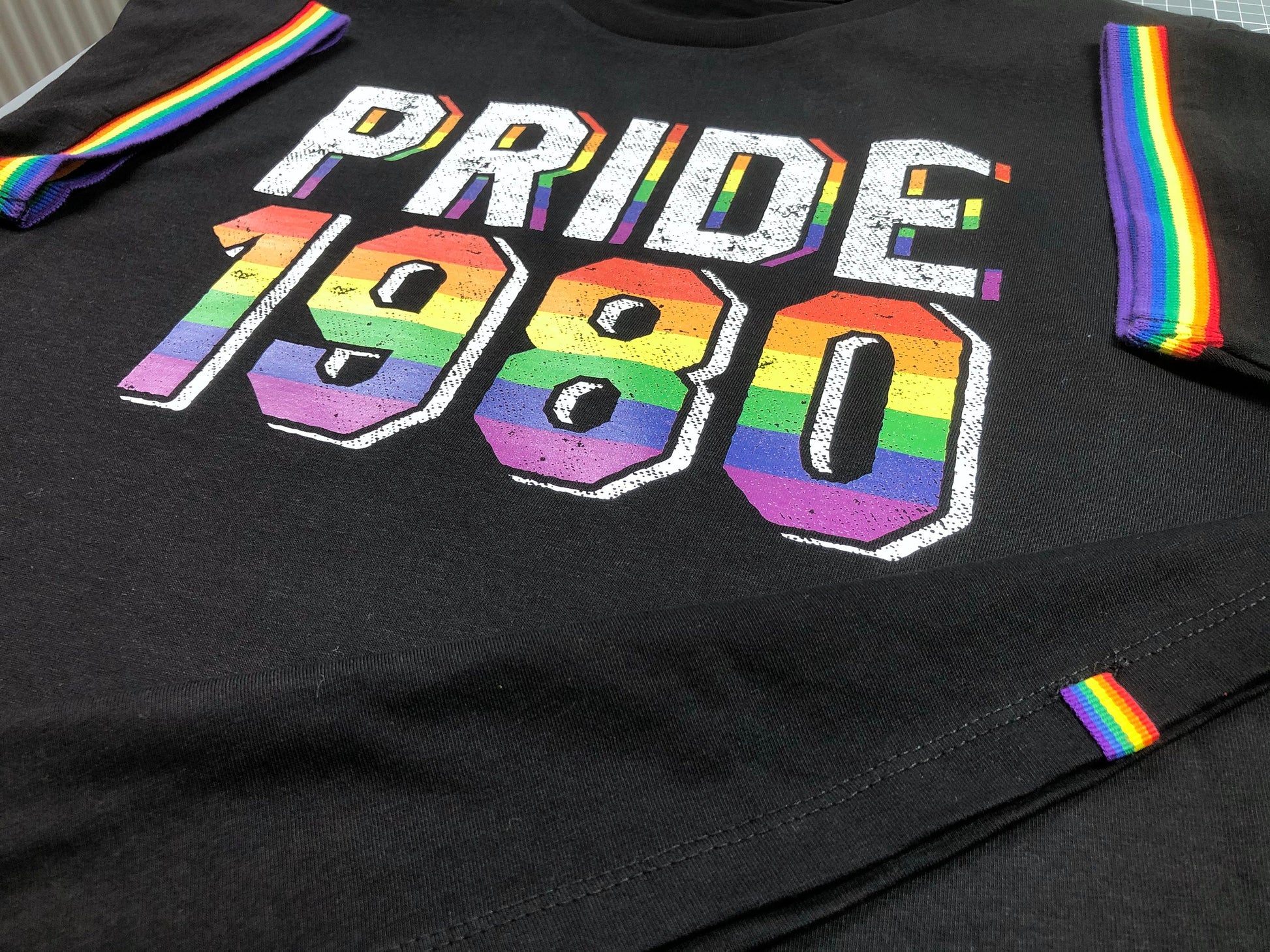 LGBTQ Gay Pride 1980 Birthday Year, Premium Unisex Rainbow Pride Stripe Sleeves and Stylish Hem Quirk